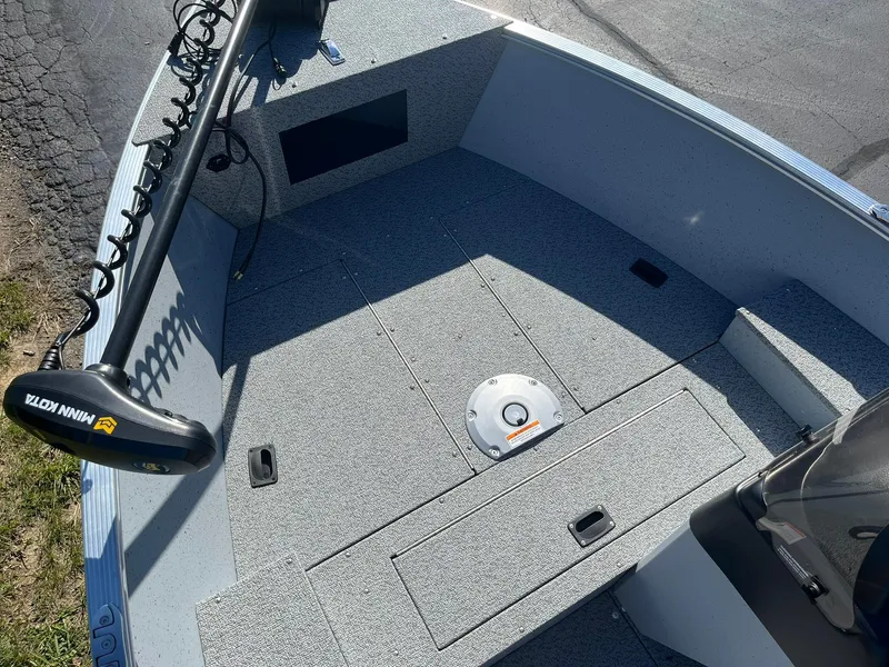 Slide: The Image of 2025 Lund 1600 Fury SS boat interior with Minn Kota trolling motor. - 11