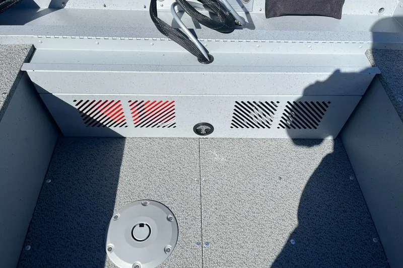 Slide: The Image of Interior of 2025 Lund 1600 Fury SS boat with storage compartment and accessories. - 13