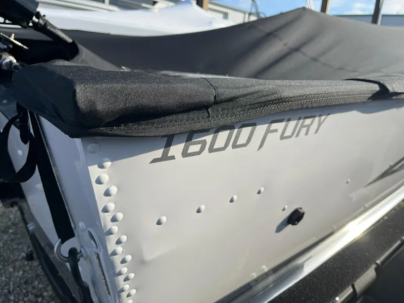 Slide: The Image of 2025 Lund 1600 Fury SS boat with cover, close-up view. - 28