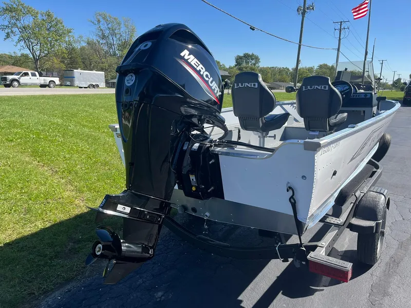 Slide: The Image of 2025 Lund 1600 Fury SS boat with Mercury outboard motor on trailer. - 4
