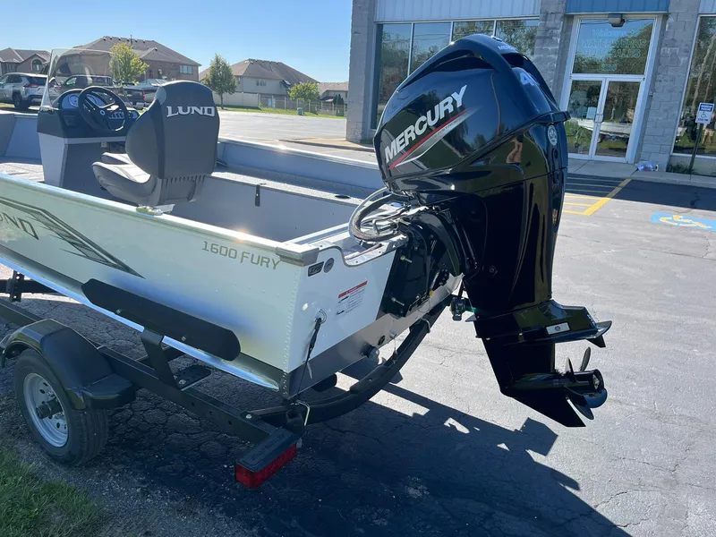 Slide: The Image of 2025 Lund 1600 Fury SS boat with Mercury outboard motor on trailer. - 5