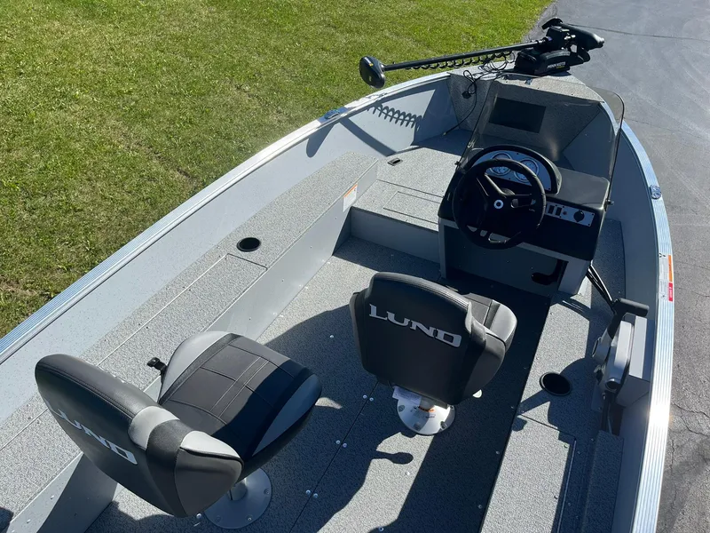 Slide: The Image of 2025 Lund 1600 Fury SS boat interior with two seats and steering console. - 8
