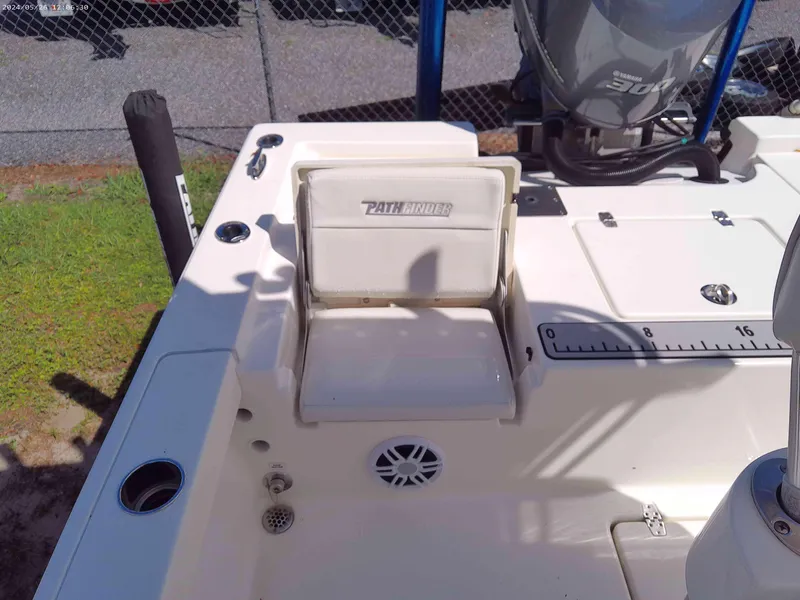 Slide: The Image of 2016 Pathfinder 2400 TRS boat interior with seating and motor details. - 10