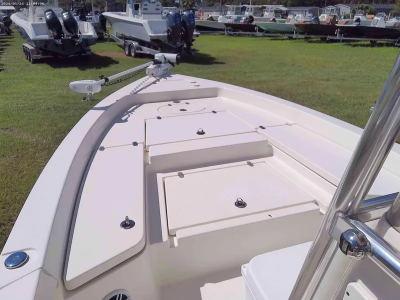 Slide: The Image of 2016 Pathfinder 2400 boat on grass, surrounded by other boats. - 3