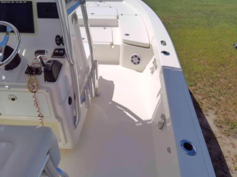 Slide: The Image of 2016 Pathfinder 2400 TRS boat interior with steering console and seating area. - 8