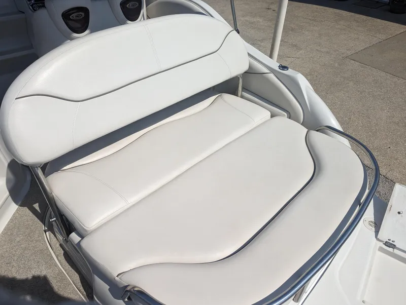 Slide: The Image of 2004 Crownline 250 CR boat seat with white upholstery and sleek design. - 12