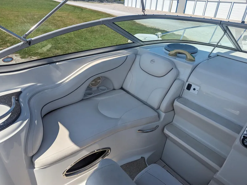 Slide: The Image of 2004 Crownline 250 CR boat interior with white leather seating and modern design. - 17