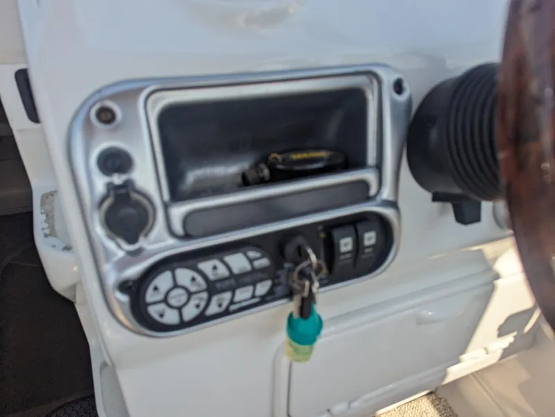 Slide: The Image of Control panel of a 2004 Crownline 250 CR boat with keys inserted. - 20