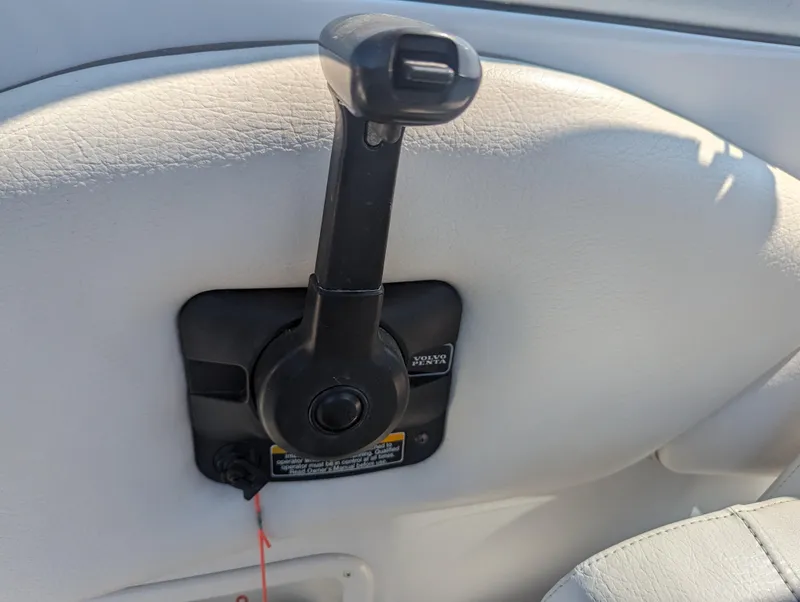 Slide: The Image of Throttle control lever on a 2004 Crownline 250 CR boat. - 23