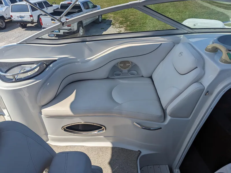 Slide: The Image of 2004 Crownline 250 CR boat interior with plush seating and modern design. - 25