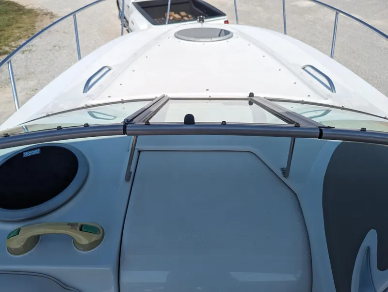 Slide: The Image of 2004 Crownline 250 CR boat deck with windshield and railing, viewed from above. - 39