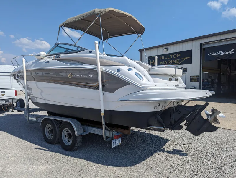 Slide: The Image of 2004 Crownline 250 CR boat on trailer at Hilltop Marine dealership. - 4