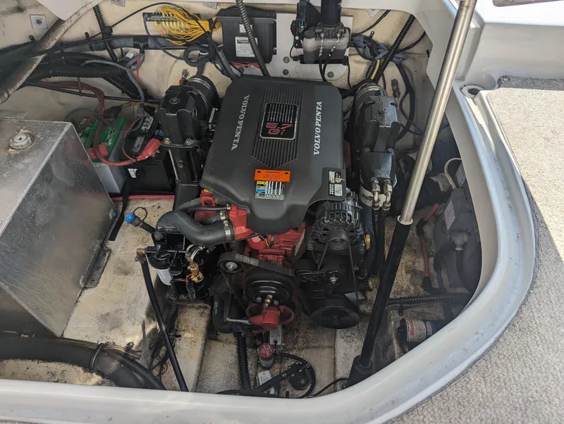 Slide: The Image of Engine compartment of a 2004 Crownline 250 CR boat, featuring a Volvo Penta engine. - 41