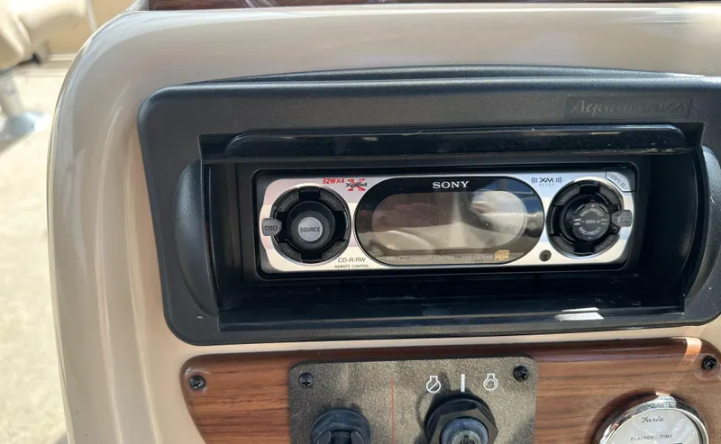 Slide: The Image of Close-up of a Sony stereo system on a 2005 Harris FloteBote Sunliner 200. - 13