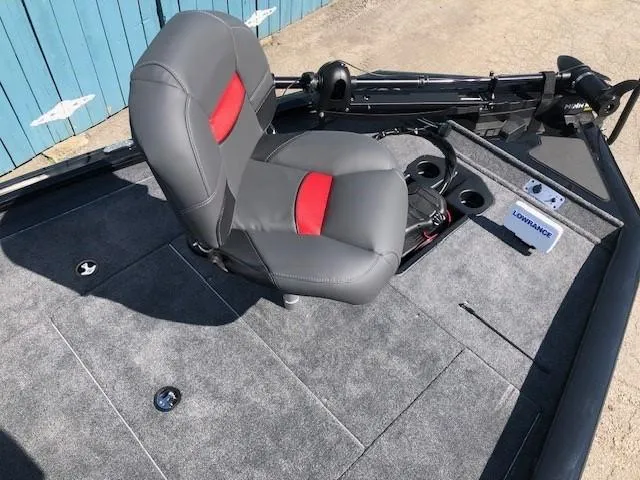 Slide: The Image of 2025 Tracker Pro Team 195 TXW Tournament Edition boat interior with gray and red seating. - 13