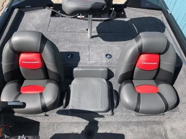 Slide: The Image of 2025 Tracker Pro Team 195 TXW Tournament Edition boat seats, gray and red design. - 19