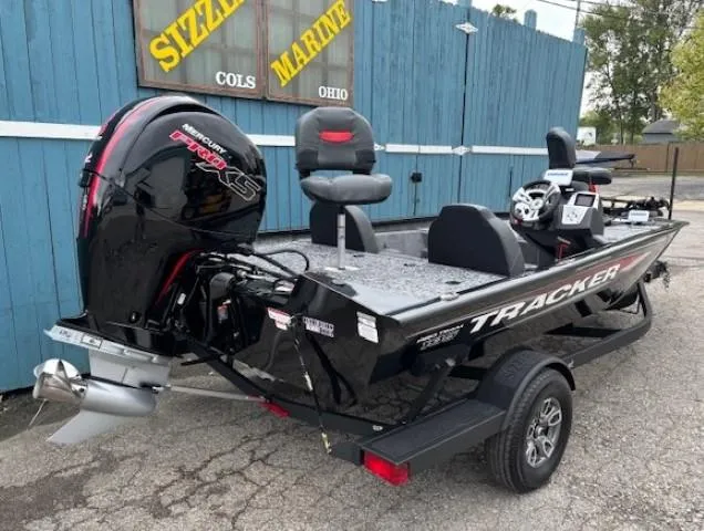 Slide: The Image of 2025 Tracker Pro Team 195 TXW Tournament Edition boat with Mercury engine at Sizzle Marine. - 2