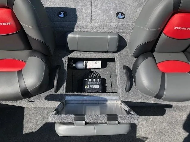 Slide: The Image of 2025 Tracker Pro Team 195 TXW Tournament Edition boat interior with storage compartment. - 20
