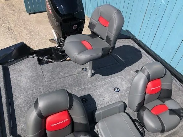 Slide: The Image of 2025 Tracker Pro Team 195 TXW Tournament Edition boat interior with gray and red seating. - 21