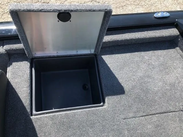 Slide: The Image of Open storage compartment on 2025 Tracker Pro Team 195 TXW Tournament Edition boat. - 25