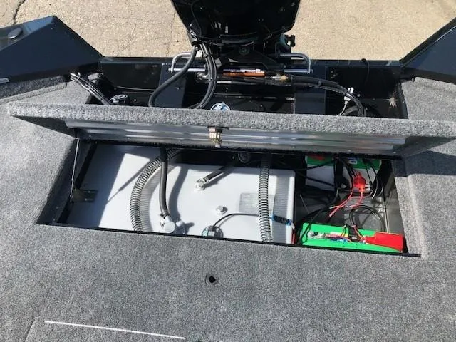 Slide: The Image of 2025 Tracker Pro Team 195 TXW Tournament Edition boat battery compartment. - 27
