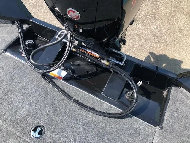 Slide: The Image of 2025 Tracker Pro Team 195 TXW Tournament Edition boat engine and deck view. - 28