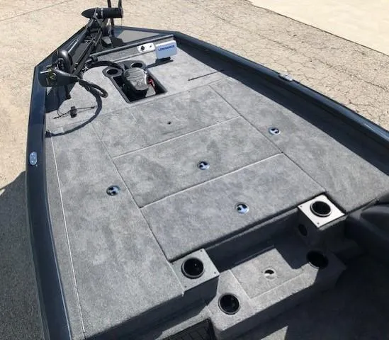 Slide: The Image of 2025 Tracker Pro Team 195 TXW Tournament Edition boat deck with fishing rod holders. - 6