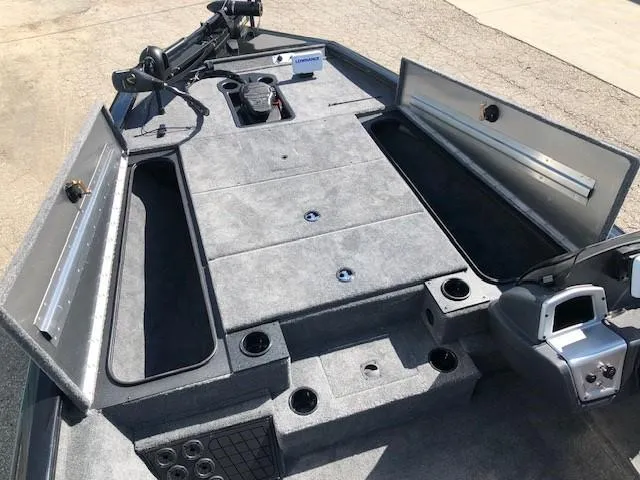 Slide: The Image of 2025 Tracker Pro Team 195 TXW Tournament Edition boat interior with storage compartments. - 8