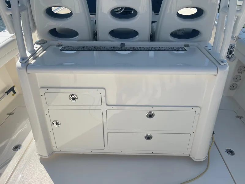 Slide: The Image of 2022 Cobia 350 boat interior with storage compartments and seating. - 9