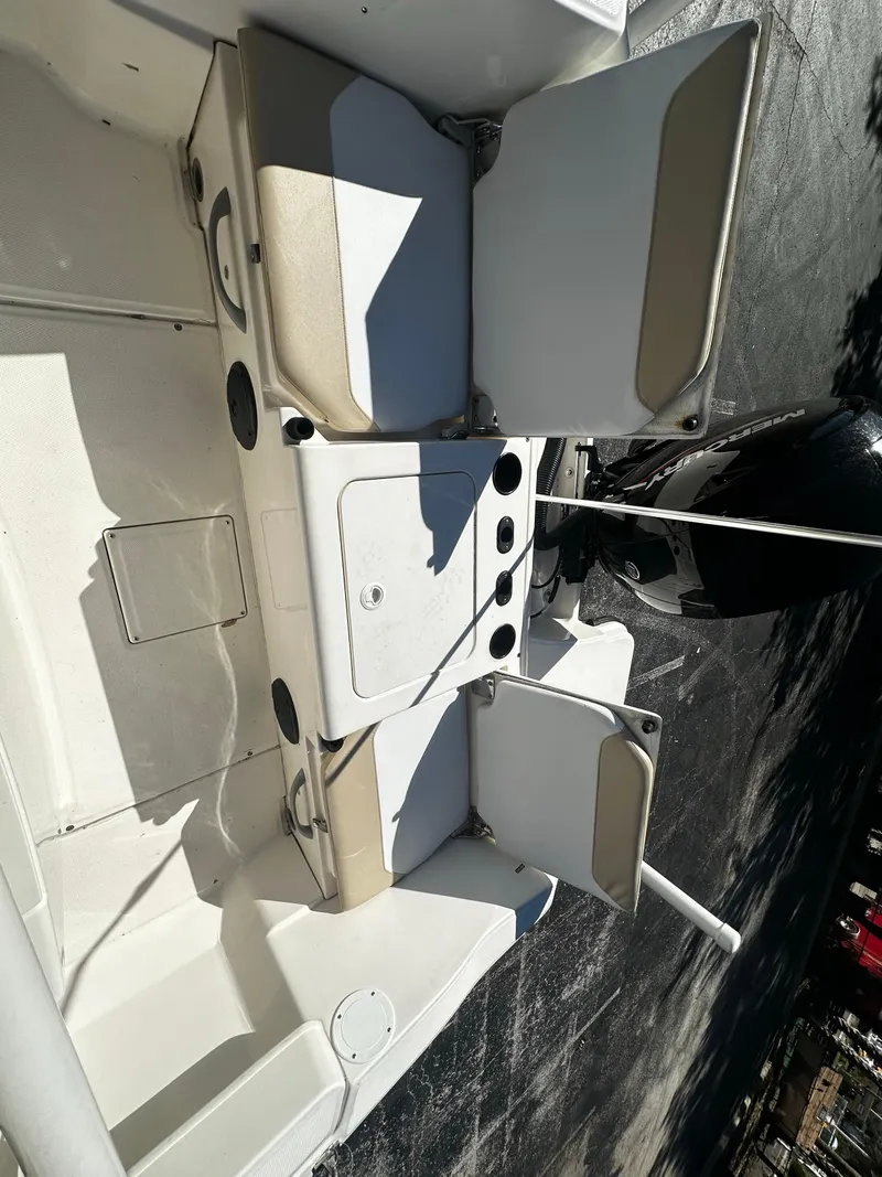 Slide: The Image of 2021 Trophy T20 boat interior with open storage compartments and seating. - 2