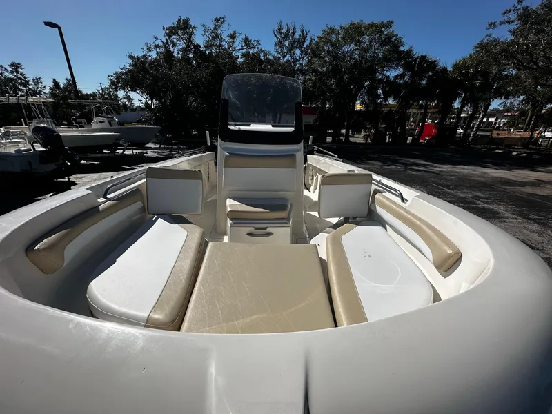 Slide: The Image of 2021 Trophy T20 boat interior with seating, parked outdoors under clear sky. - 5