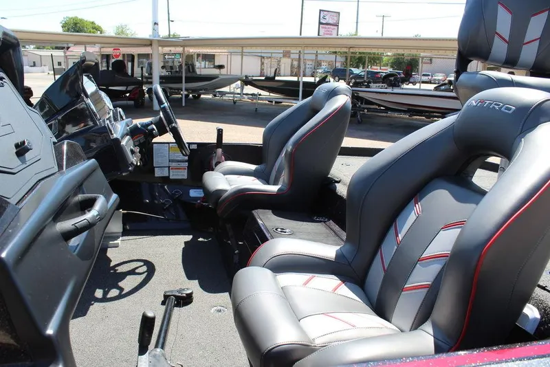 Slide: The Image of 2022 Nitro Z19 Pro boat interior with sleek seating and modern dashboard. - 11