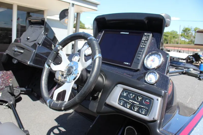 Slide: The Image of Interior of 2022 Nitro Z19 Pro boat with steering wheel and control panel. - 12