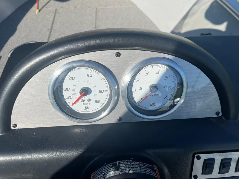 Slide: The Image of Dashboard of 2025 Lund 1600 Fury SS boat with speedometer and tachometer. - 24