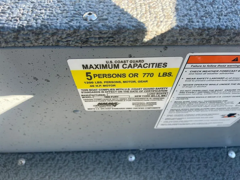 Slide: The Image of Lund 1600 Fury SS 2025 boat capacity label, maximum 5 persons or 770 lbs. - 25