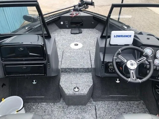 Slide: The Image of 2025 Tracker Targa V18 Combo boat interior with Lowrance system and steering wheel. - 10