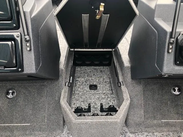 Slide: The Image of 2025 Tracker Targa V18 Combo boat storage compartment, open and empty. - 11