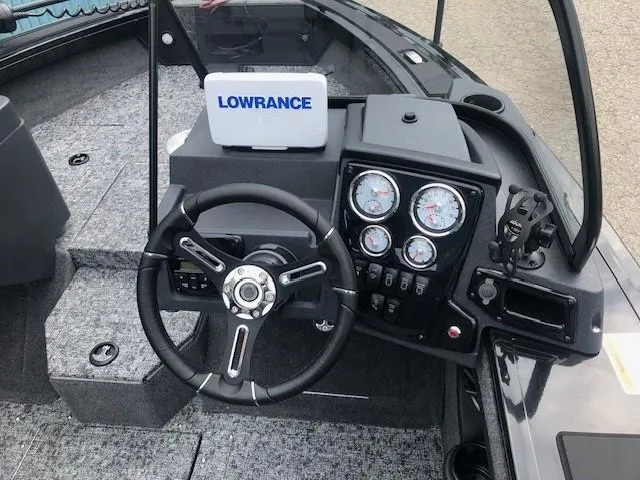 Slide: The Image of 2025 Tracker Targa V18 Combo boat dashboard with Lowrance system and gauges. - 14