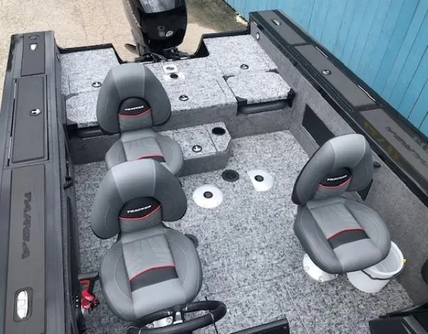 Slide: The Image of 2025 Tracker Targa V18 Combo boat interior with gray seating and carpeted flooring. - 15