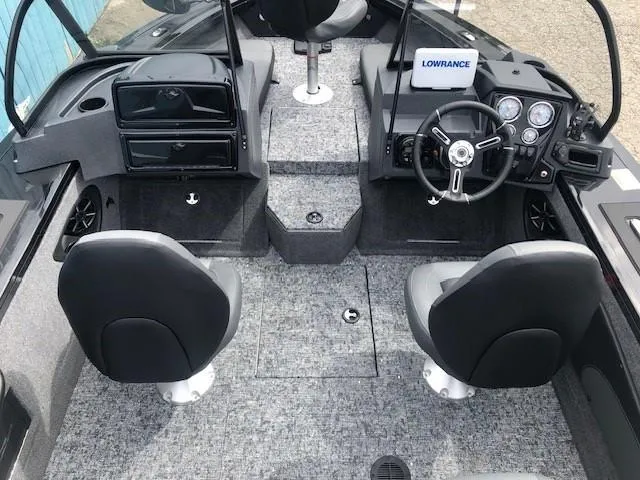 Slide: The Image of 2025 Tracker Targa V18 Combo boat interior with dual seats and modern dashboard. - 16