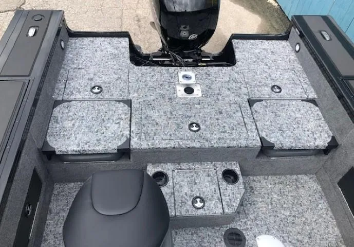 Slide: The Image of 2025 Tracker Targa V18 Combo boat interior with gray carpet and seating. - 20