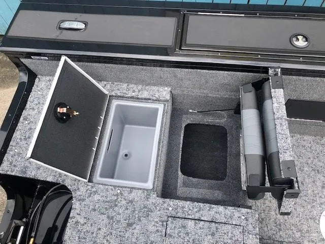 Slide: The Image of 2025 Tracker Targa V18 Combo boat interior with storage compartments and seating. - 24