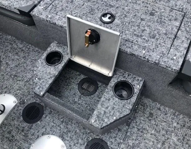 Slide: The Image of Interior of 2025 Tracker Targa V18 Combo boat with cup holders and storage compartment. - 27