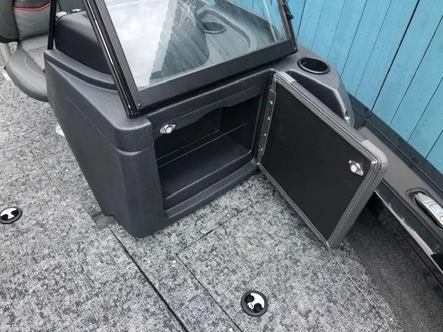 Slide: The Image of 2025 Tracker Targa V18 Combo boat interior storage compartment with open door. - 8