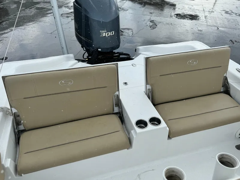 Slide: The Image of 2017 Sportsman Masters 267 Bay Boat with Yamaha 300 engine, featuring tan seating and cup holders. - 12