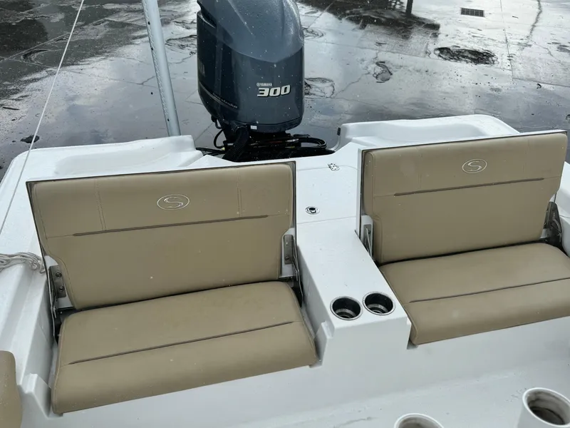 Slide: The Image of 2017 Sportsman Masters 267 Bay Boat with Yamaha 300 engine, featuring dual tan seats. - 13