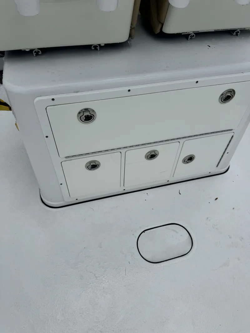 Slide: The Image of 2017 Sportsman Masters 267 Bay Boat storage compartments on deck. - 14