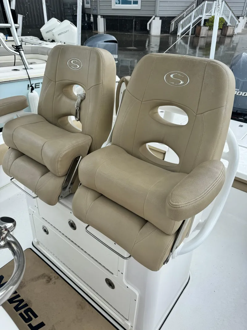 Slide: The Image of 2017 Sportsman Masters 267 Bay Boat with dual beige captain chairs. - 19