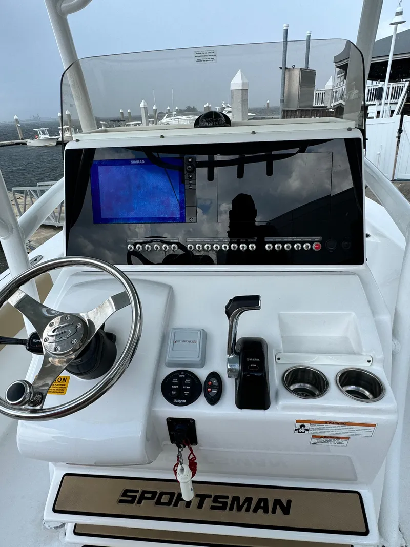 Slide: The Image of 2017 Sportsman Masters 267 Bay Boat dashboard with steering wheel and navigation display. - 20