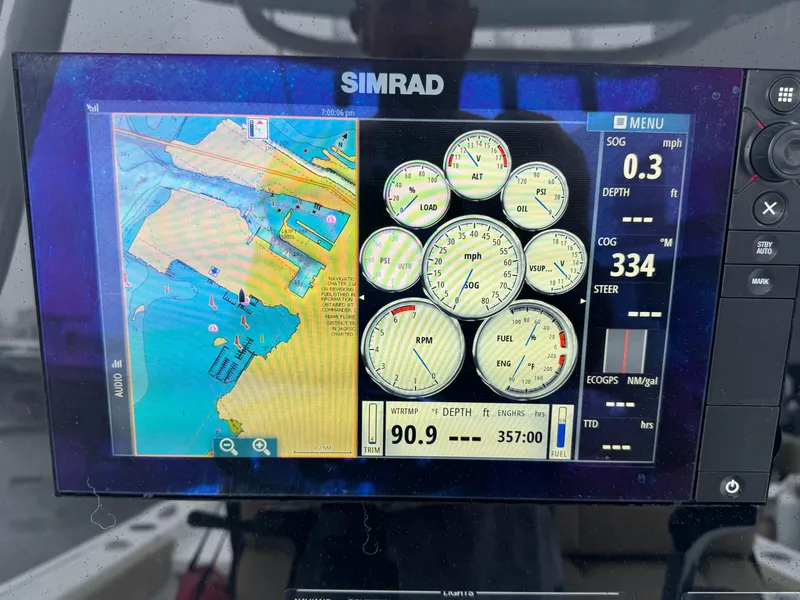Slide: The Image of Simrad navigation display on 2017 Sportsman Masters 267 Bay Boat showing map and gauges. - 22